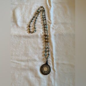 Elegant Beaded Necklace with Intricate Pendant